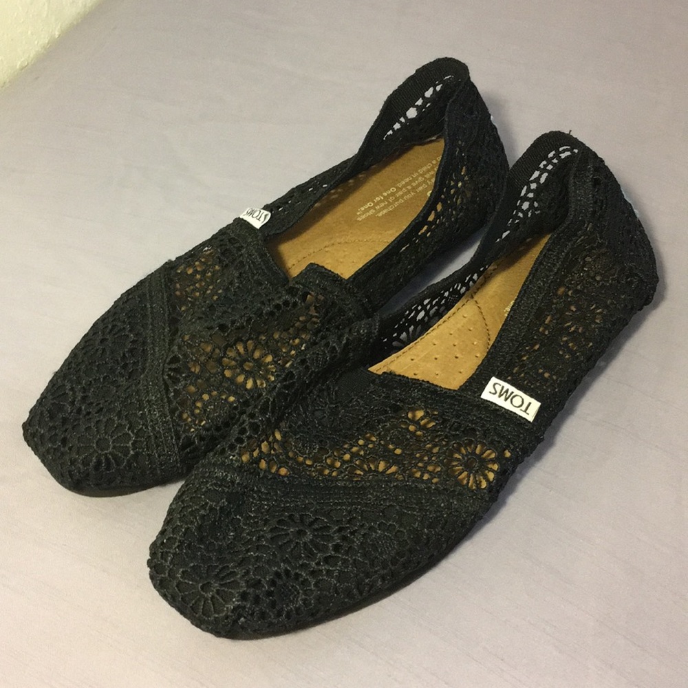 Black lace-like toms flats